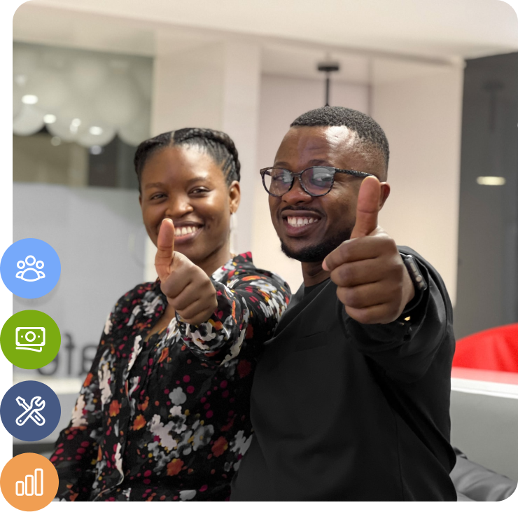 two people smiling with thumbs up